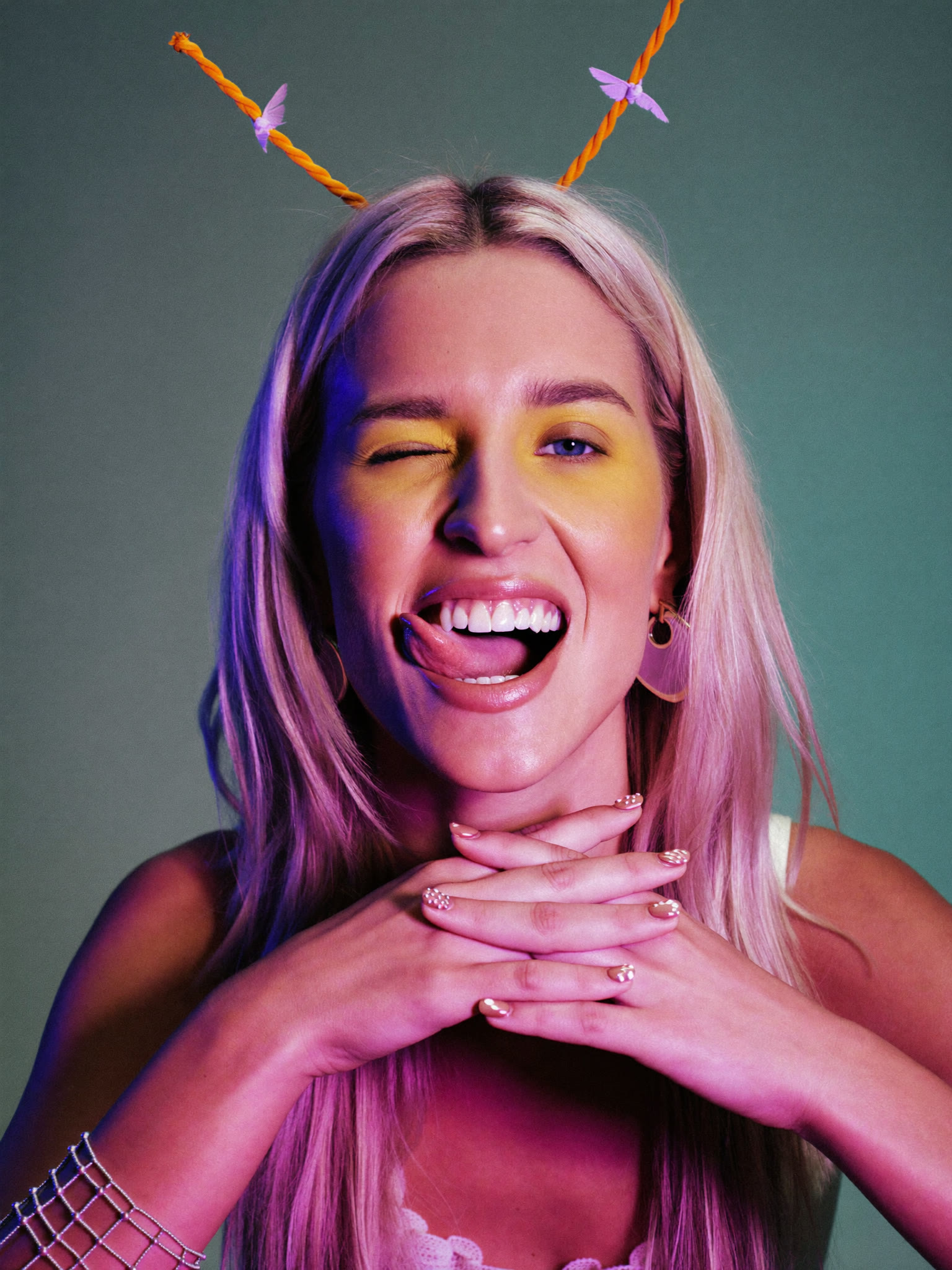 Pink and green gel-lit studio portrait
